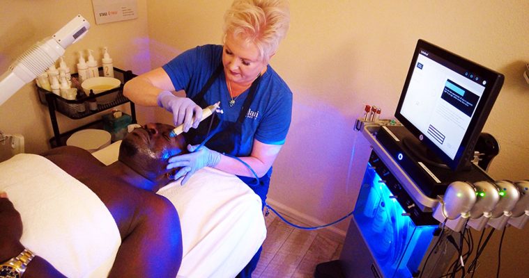 Woman giving a man a HydraFacial